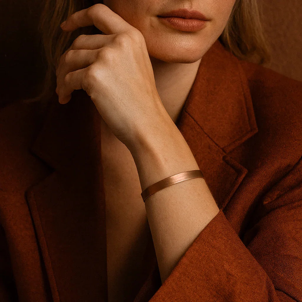Woman wearing a rust-colored coat against a matching background