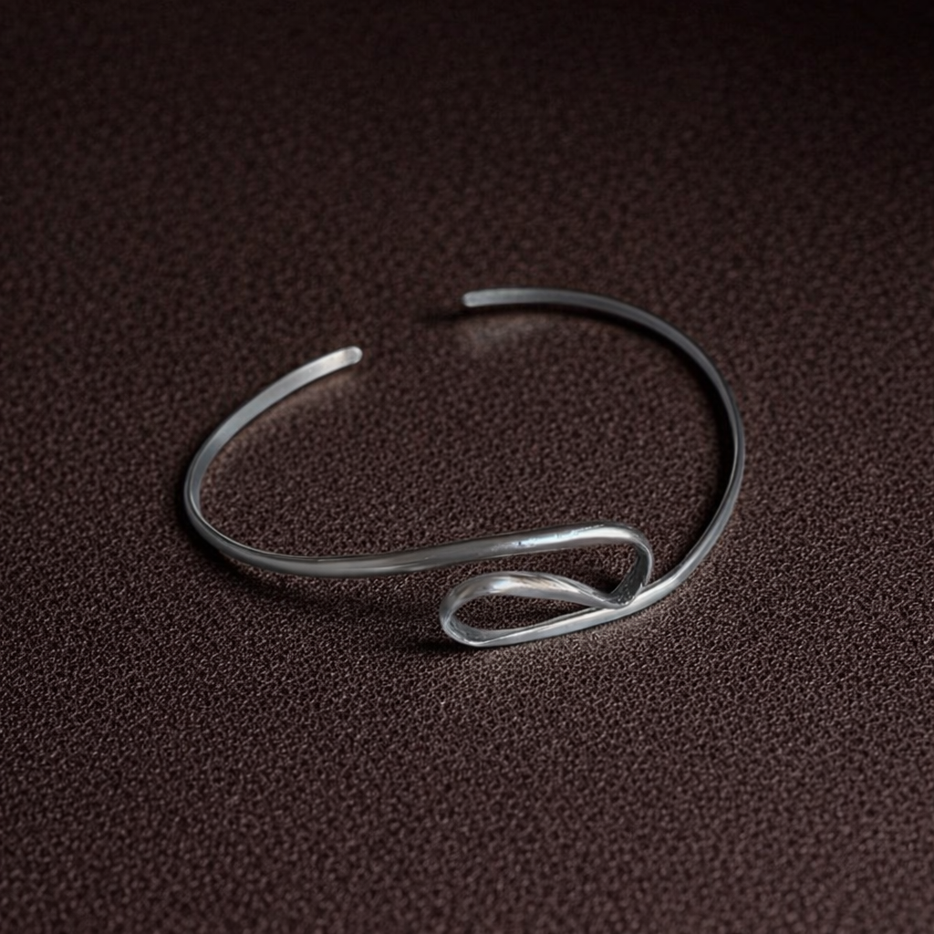 Silver bracelet on a brown textured surface