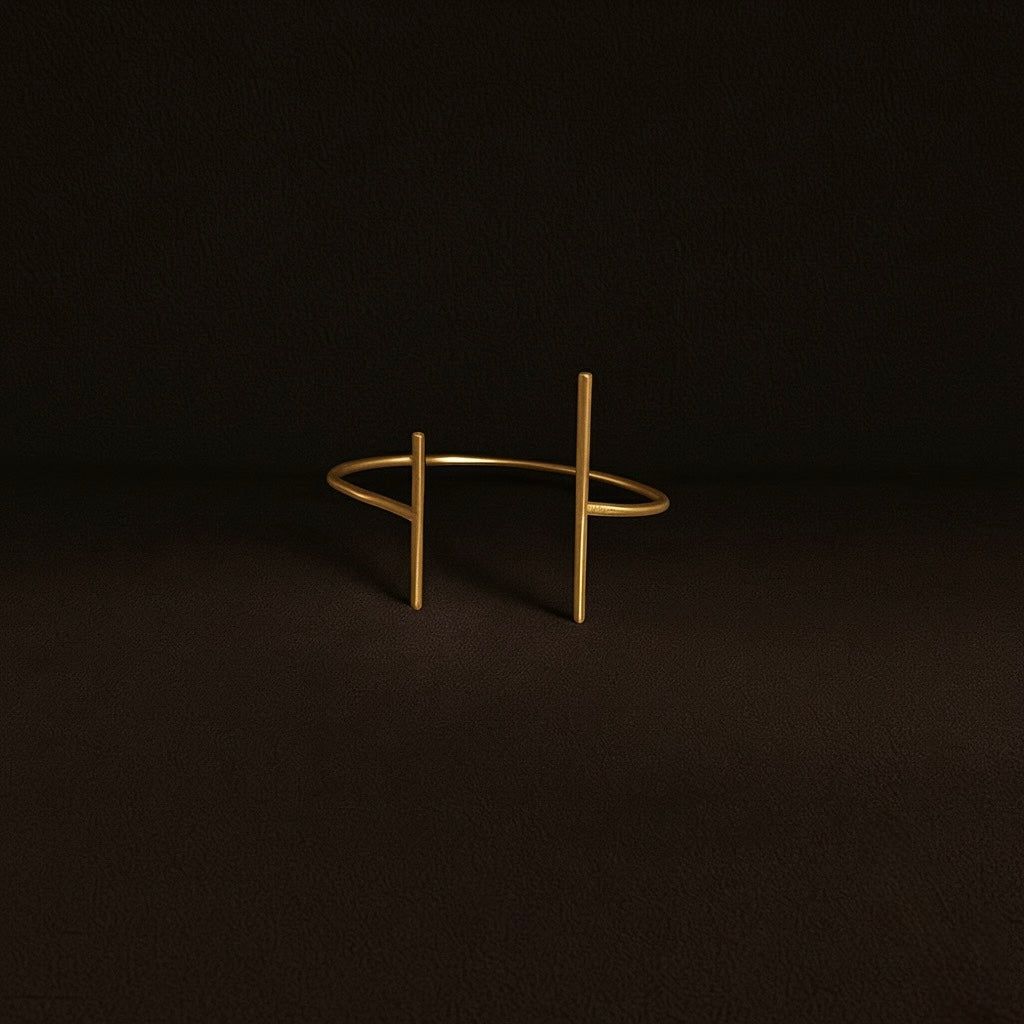 Gold bracelet on a dark background