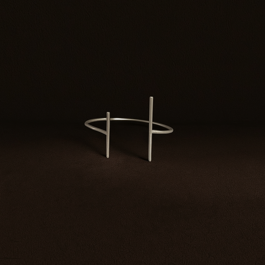 Silver bracelet on a dark brown background