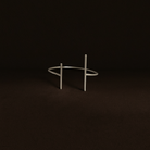 Silver bracelet on a dark brown background