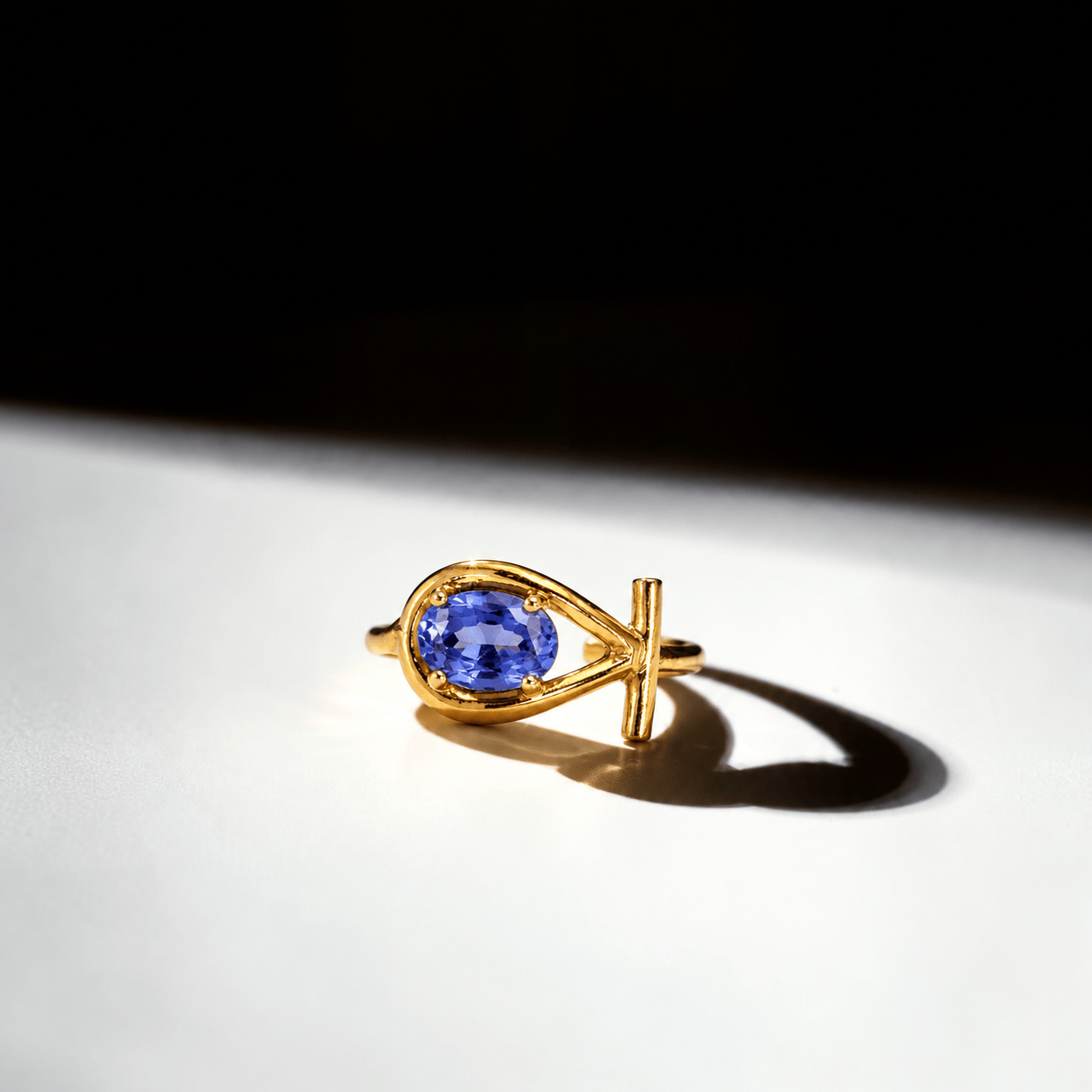 ANKHARA Tanzanite Ring – Ankh-shaped gold-plated ring with an oval tanzanite